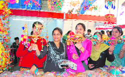 Girls buying handicrafts at a fair in the police ground at Dharamsala on Thursday.