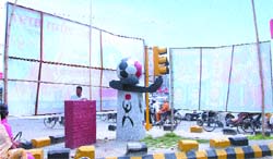 Covered from two sides by banners, Football Chowk is almost an invisible entity