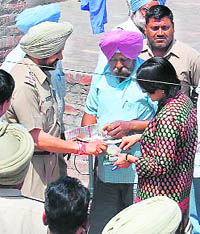 Senior police officials, including DIG Gurpreet Deo (extreme right), inspect the material seized at the site of blast in Amritsar on Thursday.