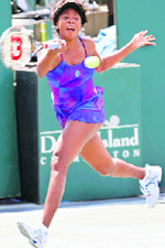 Venus Williams returns a shot to Sania Mirza (inset) during the Family Circle Cup tennis tournament on Wednesday.