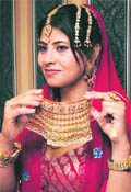 A model displays the collection of Art Karat in an exhibition in Ludhiana.