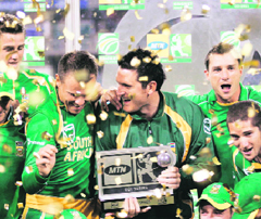 South Africa's captain Graeme Smith (C) holds the trophy as he celebrates with teammates after winning the ODI cricket series 3-2 against Australia at the Wanderers stadium in Johannesburg, South Africa, on Friday.
