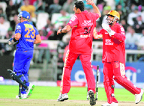 Bangalore Royal Challengers Anil Kumble (C) reacts after taking the wicket of Rajasthan Royals Shane Warne (L) during the Indian Premier League Twenty20 match in Cape Town, South Africa, on Saturday.