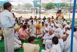 People attend a mahapanchayat at Khandsa village near Gurgaon on Sunday. 