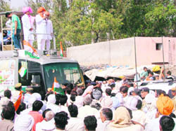 Chief Minister Bhupinder Singh Hooda addresses a rally in the Kalayat Assembly segment to mobilise support for Naveen Jindal on Sunday. 