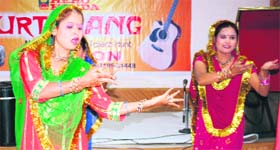 Girls perform during a singing talent hunt Surtarang organised by the Sangam Kala Group in Jammu