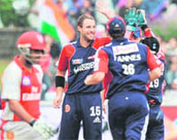 Daniel Vettori of Delhi Daredevils (c) celebrates with teammates after taking the wicket of England cricketer Ravi Bopara. 