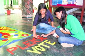 Students take part in a rangoli competition at a private educational institute in Dehradun