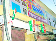 Party flags on a building in Rohtak.