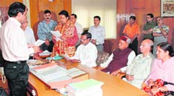 BJP candidate Anurag Thakur taking oath from the returning officer after filing his nomination papers from the Hamirpur constituency