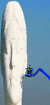 Workers put finishing touches to the 20-m tall statue Dream by Spanish artist Jaume Plensa near St Helens in northern England on Monday.