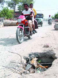The potholed Batala Road in Amritsar is a nightmare for commuters