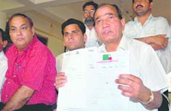 Kashi Singh Airy, senior Uttarakhand Kranti Dal leader, with his resignation papers in Dehradun