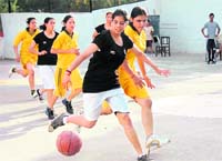 A match in progress at the District Junior Under-18 Basketball Championship in Dehradu