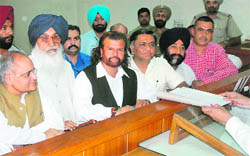 SAD candidate Hans Raj Hans, along with CM Parkash Singh Badal, BJPs state in charge Balbir Punj, files nomination papers in Jalandhar on Tuesday.