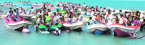 This handout picture released by the Sri Lankan Navy on Tuesday shows Sri Lankan Tamil civilians on boats after they escaped from Tamil rebel-held territory and arrived at the northern Point Pedro coast.