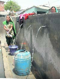 water flowing unchecked in Colony No 4 due to the absence of taps