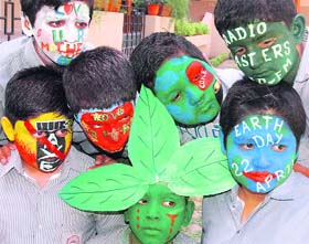 Students of DAV Model School, Sector 15, paint their face to mark the World Earth Day in Chandigarh