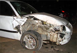 A car that collided with a bus at Bajghera railway crossing near Palam Vihar on Tuesday night. Two persons died, while 20 were injured in the mishap.