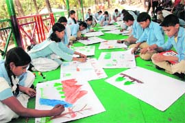 School students at a painting contest at Malsi Deer Park at an Earth Day function in Dehradun
