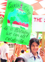 Schoolchildren create awareness regarding environmental issues to mark Earth Day in Gurgaon on Wednesday.