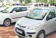 Vehicles that were part of SAD candidate Gurcharan Singh Galib’s motorcade bear “private vechicle” stickers at Jagraon on Wednesday.