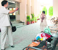 The bags of students lie outside the examination hall in Ludhiana on Thursday.