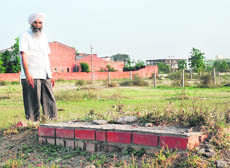 Remains of the foundation stone of  a paper mill laid by late Prime Minister Rajiv Gandhi in 1988.