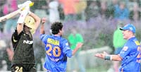 NOt a knight to remember: Shane Warne (R) of Rajasthan Royals congratulates teammate Kamran Khan (C) for taking the wicket of Sourav Ganguly of Kolkata Knight Riders during the IPL T20 match at the Newlands Cricket Stadium in Cape Town 