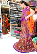 A customer selects a bridal lehnga at a shop in Amritsar