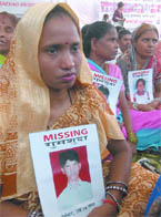 Parents of missing kids hold a demonstration to draw the attention of MPs and aspiring MPs who are busy campaigning, in New Delhi on Friday.