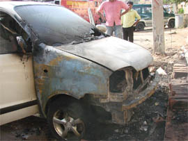 A Santro car that caught fire in Gurgaon on Friday.