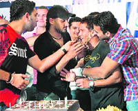 Yuvraj Singh, Harbhajan Singh and Zaheer Khan smear cake on the face of Sachin Tendulkar, who celebrates his 36th birthday in Durban on Friday.