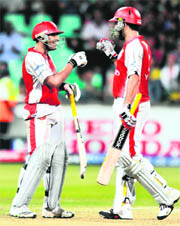 Ravi Bopara (L) bumps gloves with Yuvraj Singh during their IPL Twenty20 match at the Kingsmead Cricket Stadium in Durban on Friday.
