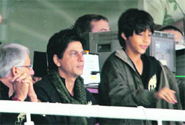 SRK (left) with his son (right) during an IPL match