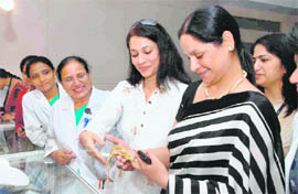 Employees of Ivy Hospital check out the diamond jewellery exhibition