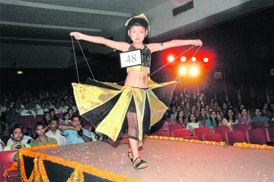 A young girl walks the ramp at a fashion show held at ONGC, Dehradun, on Saturday.