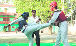 Players slug it out during a match in Dehradun on Saturday.