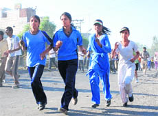 Youngsters take part in a marathon organised by NIFAA in Karnal on Saturday.