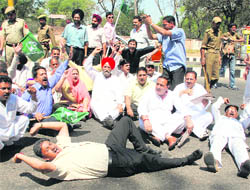 PDP workers protest near the office of the Electoral Officer in Jammu on Saturday.