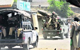 Pakistani army soldiers patrol in Buner district