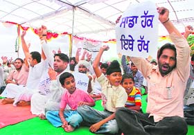 Members of the Pind Bachao Committee during a meeting at Raipur Kalan in Chandigarh
