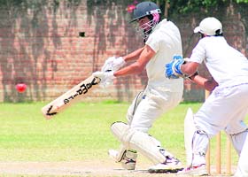 A batsman plays a shot during a match in Ludhiana