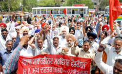 Members of PSSF block Bathinda-Mansa road and the entry of bus stand in support of their demands on Tuesday.