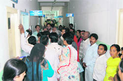 Patients make a beeline in the corridors of Doon Hospital. 