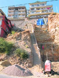 A hill being cut vertically for the construction of a building near Kusumpati on the bypass road in Shimla