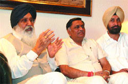 Punjab CM Parkash Singh Badal, along with Local Bodies Minister Manoranjan Kalia, talks to the press in Jalandhar on Tuesday.