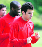 Arsenals Spanish midfielder Cesc Fabregas (R) takes part in a training session at London Colney on Tuesday. Arsenal play Manchester United in a UEFA Champions League semifinal first leg at Old Trafford on Wednesday.