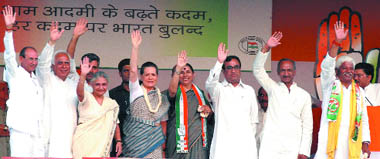Congress president Sonia Gandhi, Delhi CM Sheila Dikshit and partys Lok Sabha poll candidates during an election rally at Ramlila Grounds in New Delhi on Wednesday.
