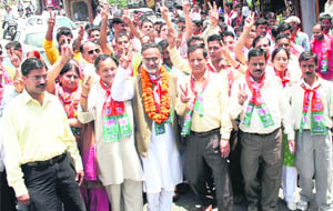  BJP candidate Rajan Sushant from the Kangra constituency during a road show at Dharamsala on Wednesday.